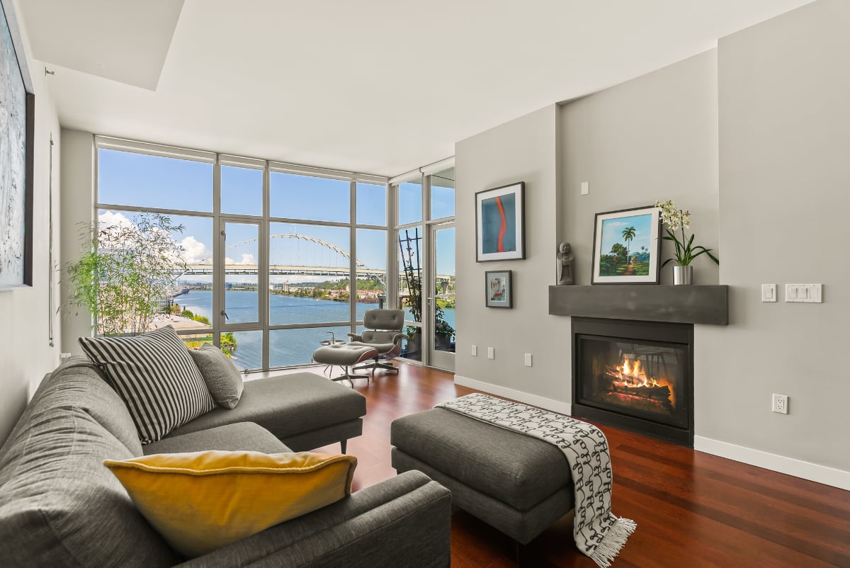 Waterfront Pearl condo living room with river views
